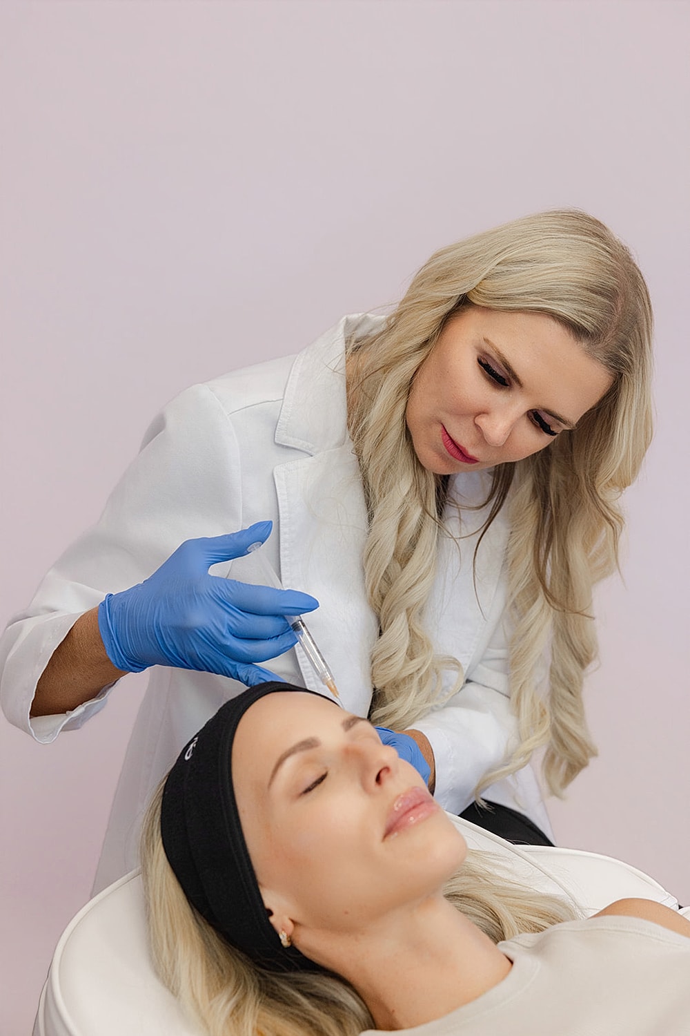 Beauty treatment in progress at a clinic.