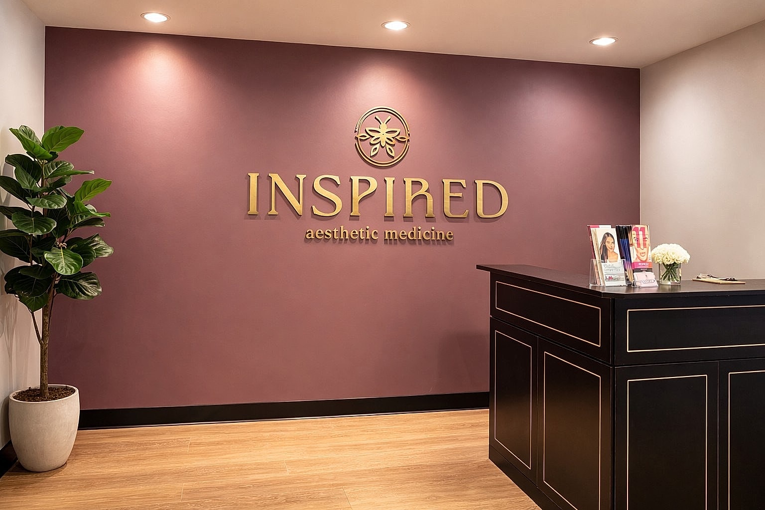 Aesthetic medicine reception area with plant.